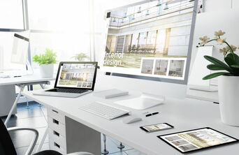 Laptop- und Smartphone-Mockup zeigt eine von 5150media erstellte, responsive Website aus dem Bereich Raumgestaltung und Interior Design.