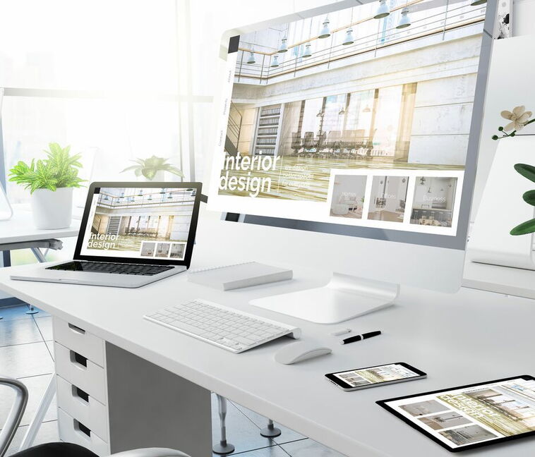 This laptop and smartphone mockup showcases a responsive website created by 5150media in the field of interior design.